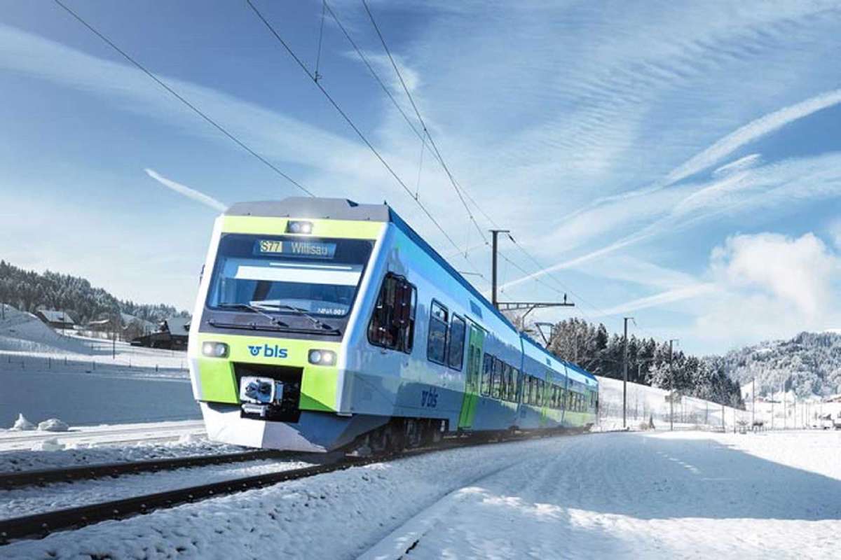 Train moving through snowy landscape